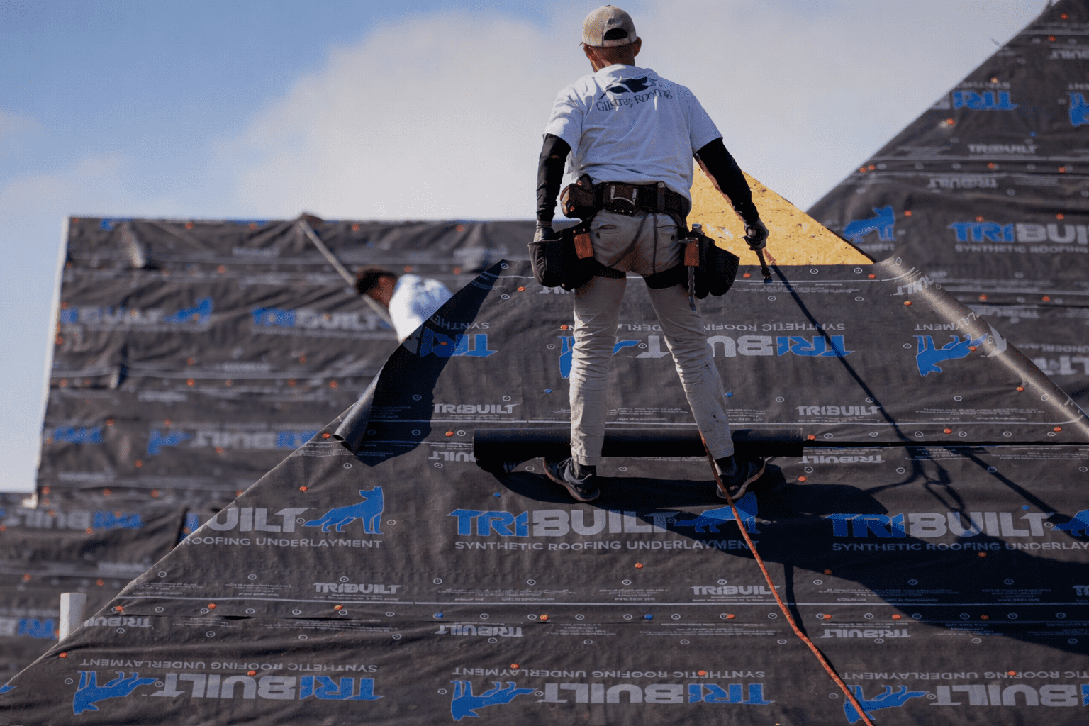 Professional San Antonio roofing company installing asphalt shingles on a residential home